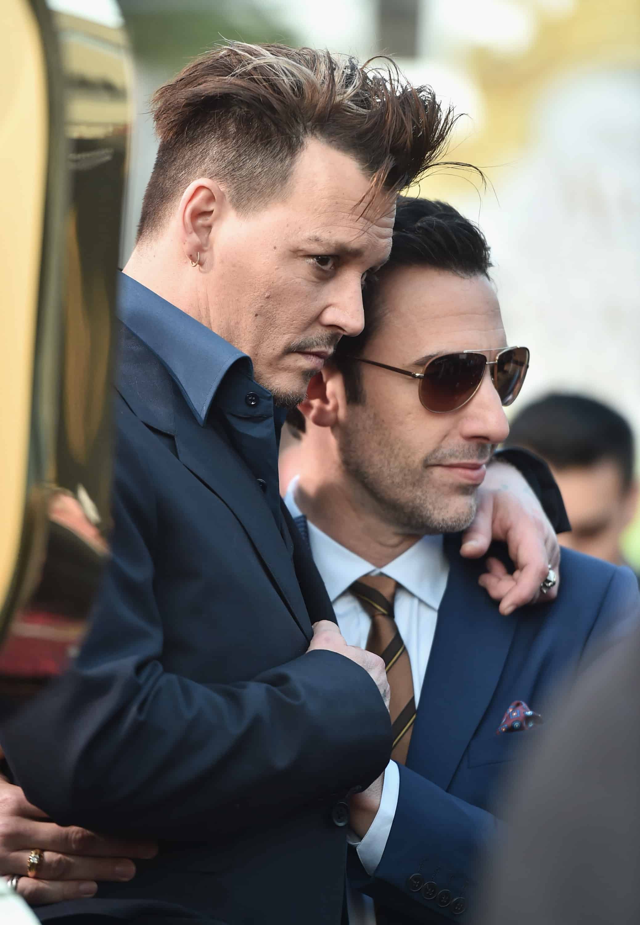 HOLLYWOOD, CA - MAY 23: Actors Johnny Depp and Sacha Baron Cohen attend Disneys 'Alice Through the Looking Glass' premiere with the cast of the film, which included Johnny Depp, Anne Hathaway, Mia Wasikowska and Sacha Baron Cohen at the El Capitan Theatre on May 23, 2016 in Hollywood, California. (Photo by Alberto E. Rodriguez/Getty Images for Disney) *** Local Caption *** Johnny Depp; Sacha Baron Cohen